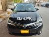 Toyota Corolla Axio Hybrid 1.5 2014 For Sale in Karachi